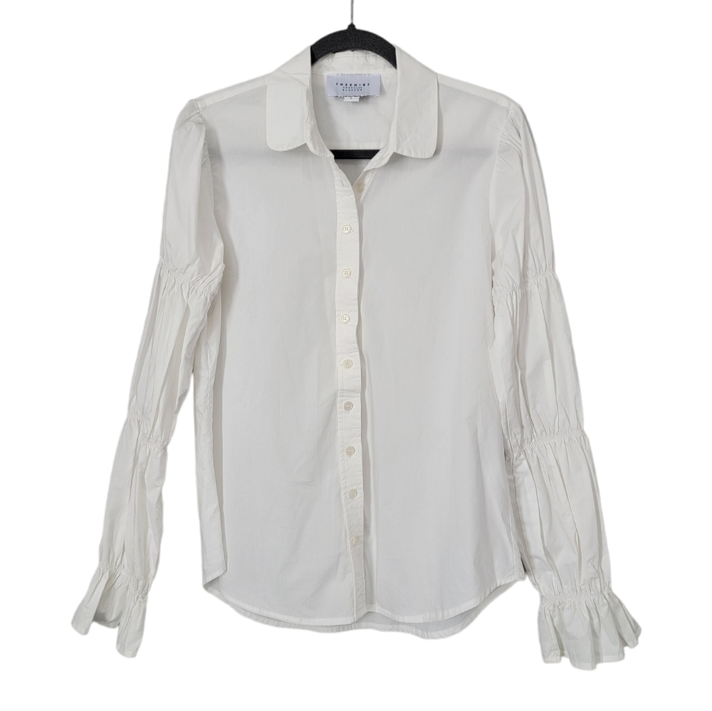 The Shirt by Rochelle Behrens white puffed sleeve ruffled cuff white button down